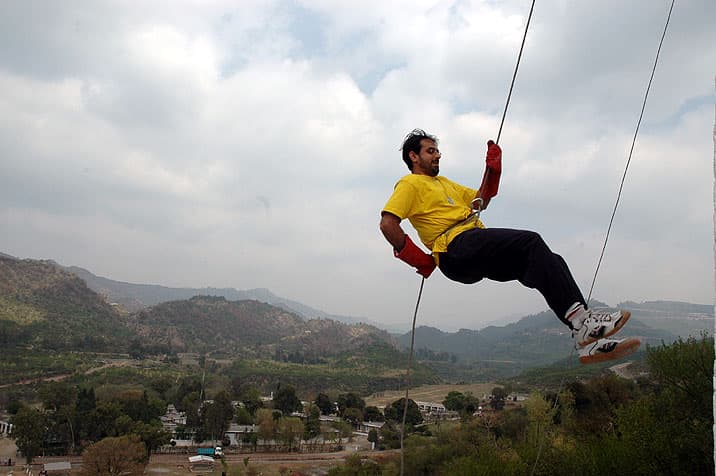 Participant rappelling during an outdoor activity