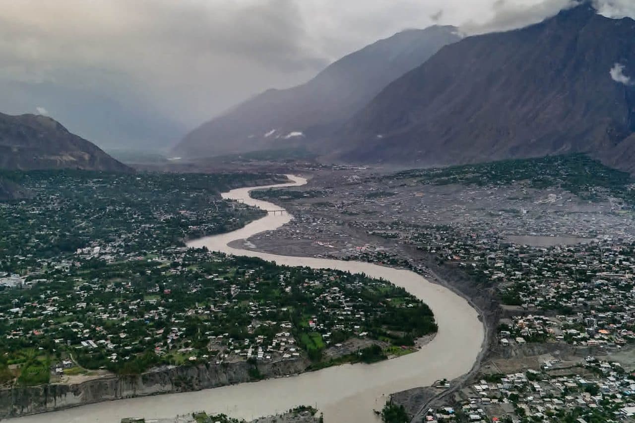 A river town in a green mountain valley